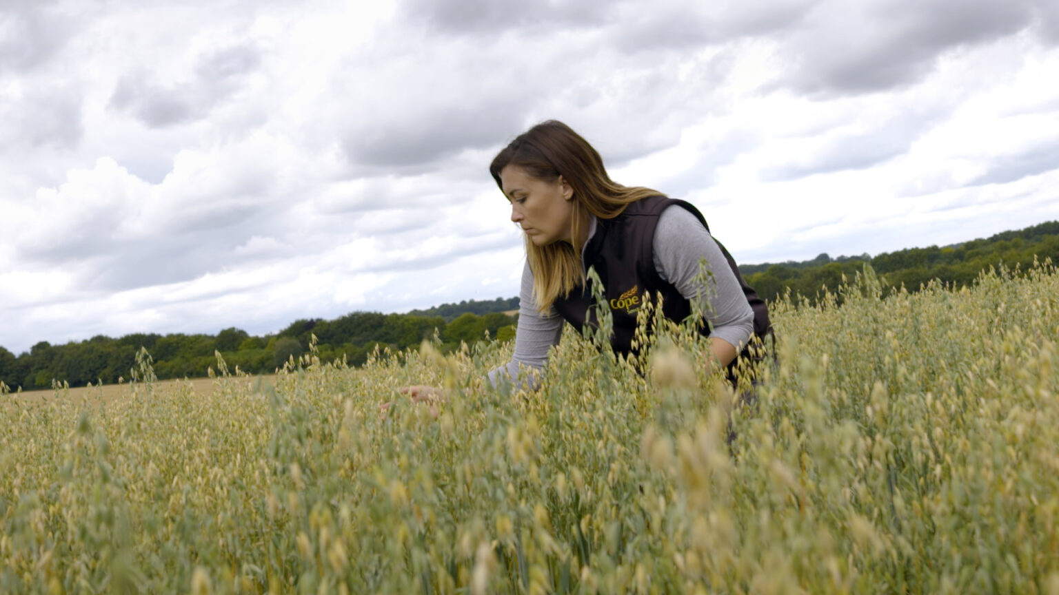 Gemma Clarke from Cope Seeds in a field of Merlin crop
